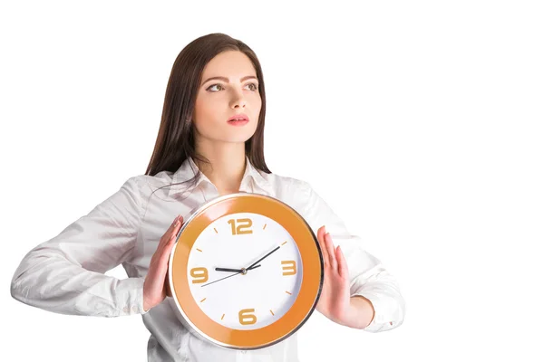 Businesswoman holding  clock Stock Picture