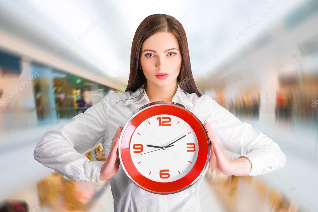 businesswoman holding  clock