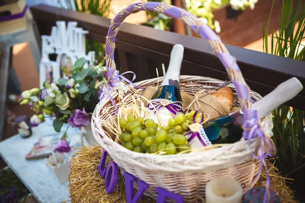 Basket with wine and fruit — Stock Photo, Image