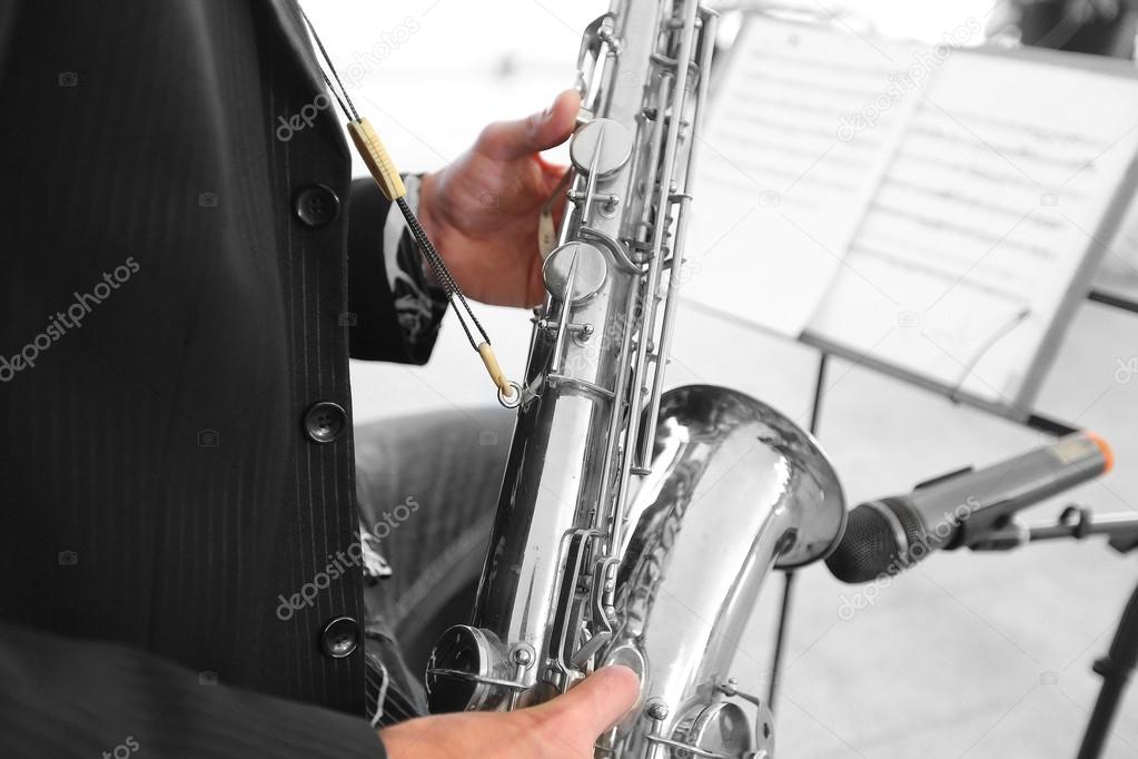 musician plays  saxophone