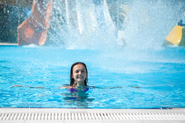 Girl in bikini sliding water park — Stock Photo, Image