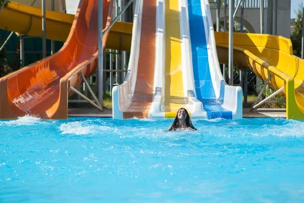 Girl in bikini sliding water park — Stock Photo, Image