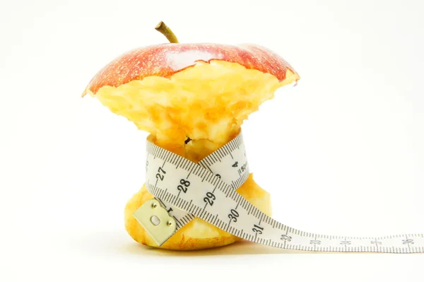 食欲不振。体重減少。測定テープとリンゴ. ストックフォト