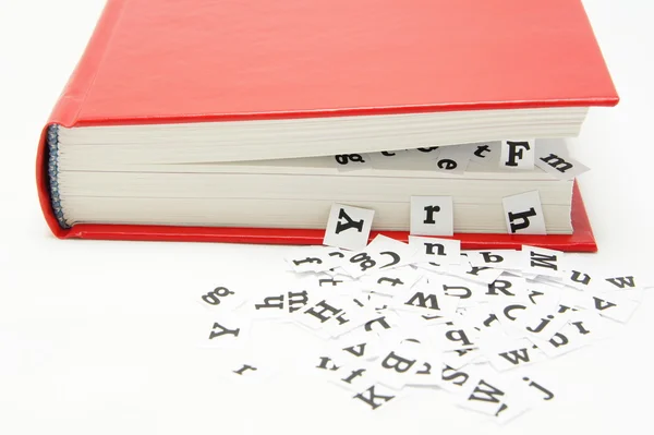 Letters falling from the middle of the book. — Stock Photo, Image