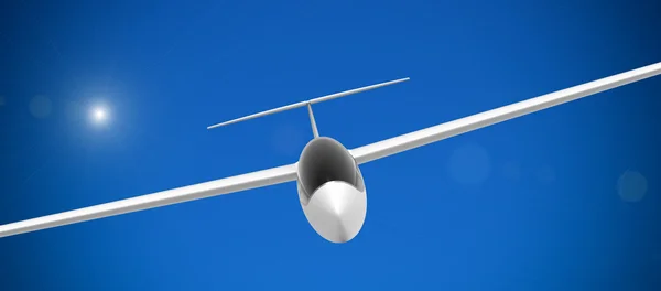 Летающий белый планер — стоковое фото