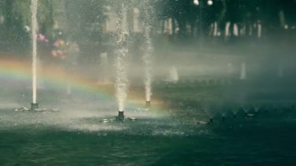 The rainbow inside the splashes of park fountane — Stock Video