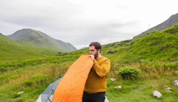 Young Attractive Man Inflating Mattress Next His Tent Solo Camping Stock Photo