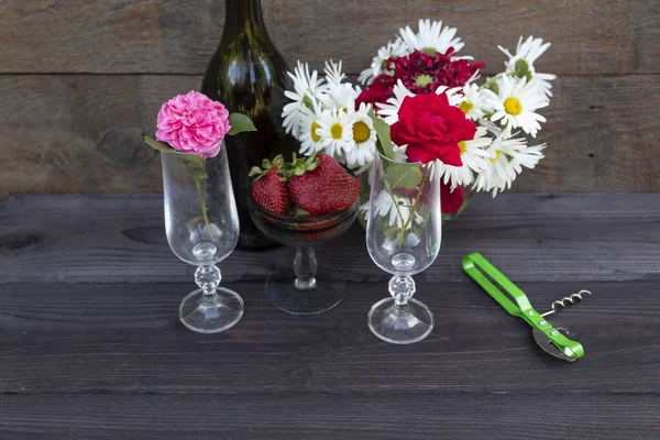 Table Bottle Wine Glasses Pink Red Roses Glass Strawberries Corkscrew Royalty Free Stock Images