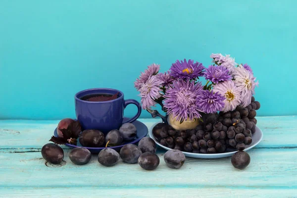 Blue Background Cup Tea Basil Leaf Bouquet Blue Asters Plums — Stock Photo, Image