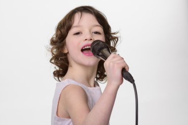 Young singer performs a song clipart