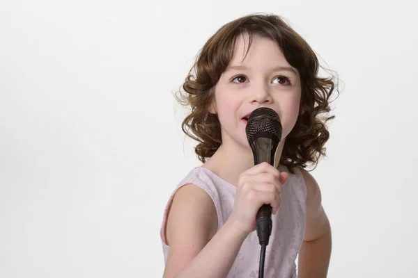 Singing lovely girl with mic — Stock Photo, Image