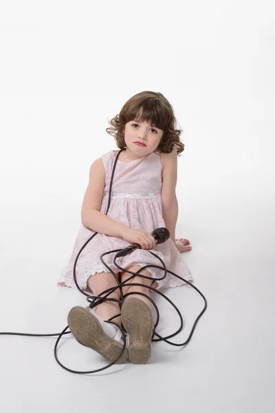 Sad girl is braided by the cable — Stock Photo, Image