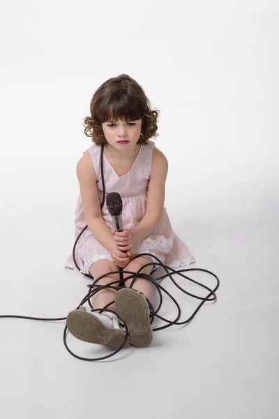 Offended little girl looks down — Stock Photo, Image