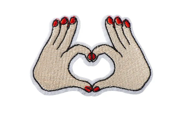 Hands making heart shape, embroidered batch isolated on white background — Stock Photo, Image