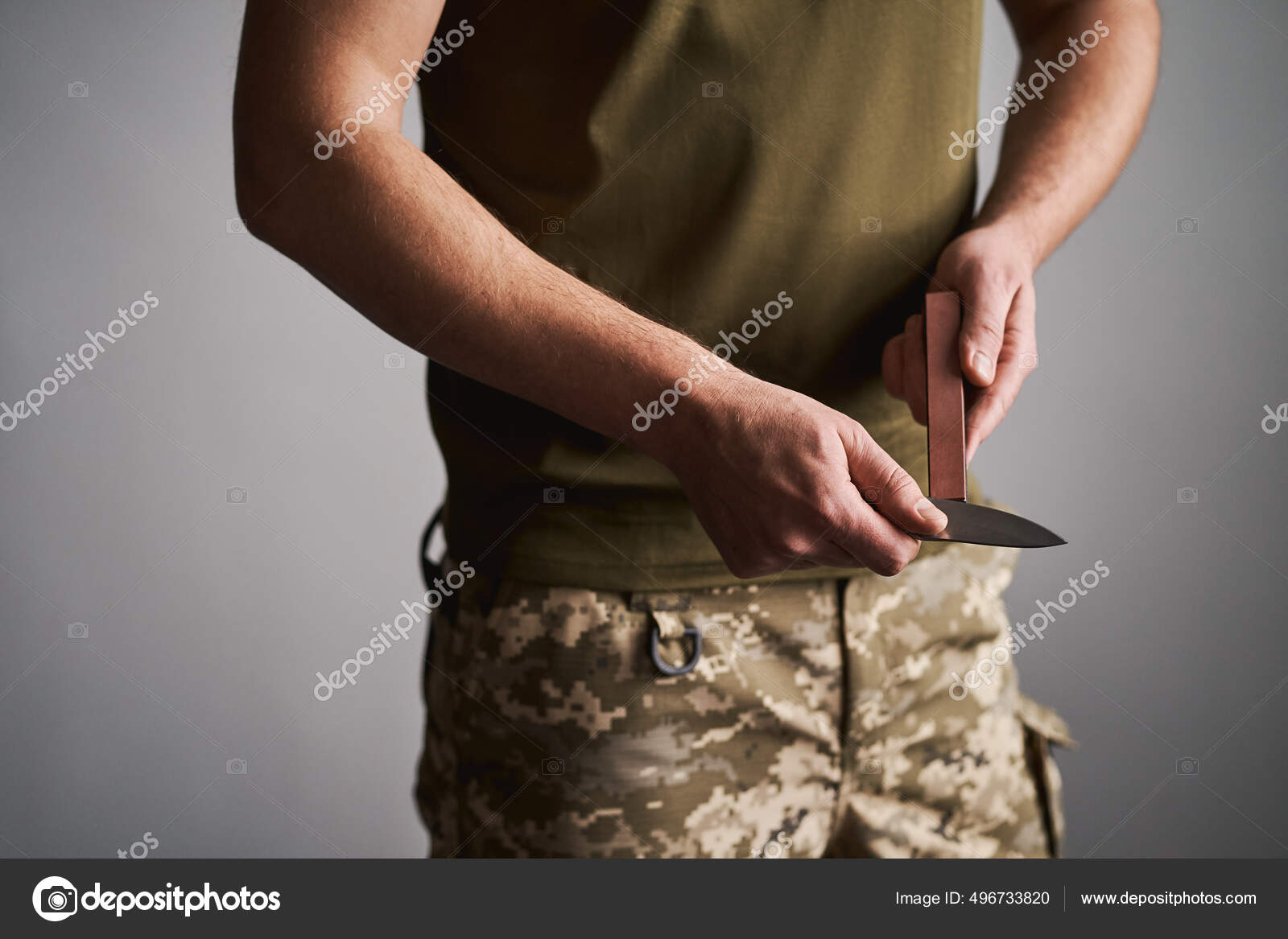 The Man Using Whetstone To Sharpening His Pocket Knife. Pocket
