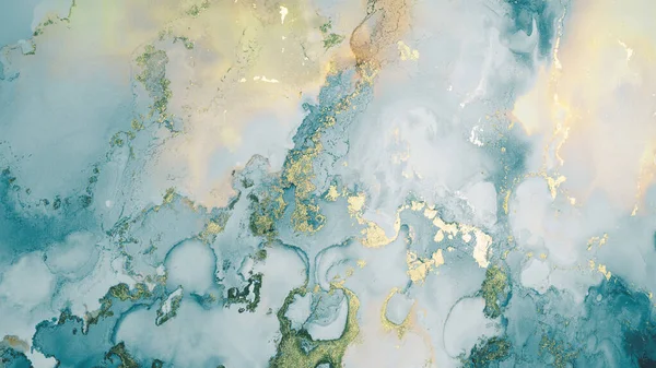 Luxury abstract fluid art painting in alcohol ink technique, mixture of blue, yellow and gold paints. Imitation of marble stone cut, glowing golden veins. Tender and dreamy design.