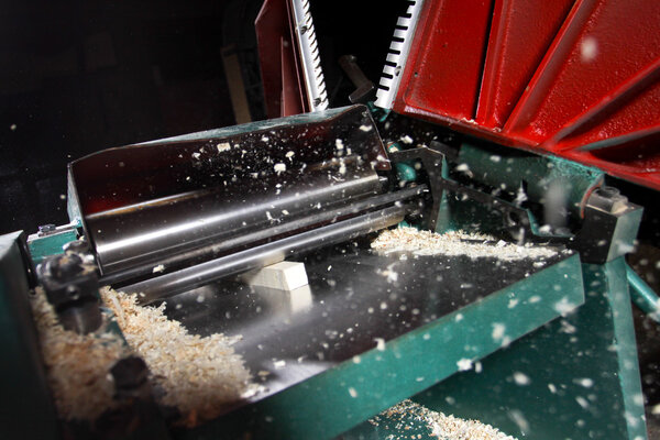 power planer on sawdust background