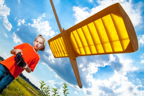 Little boy playing with handmade RC airplane toy — Stock Photo, Image