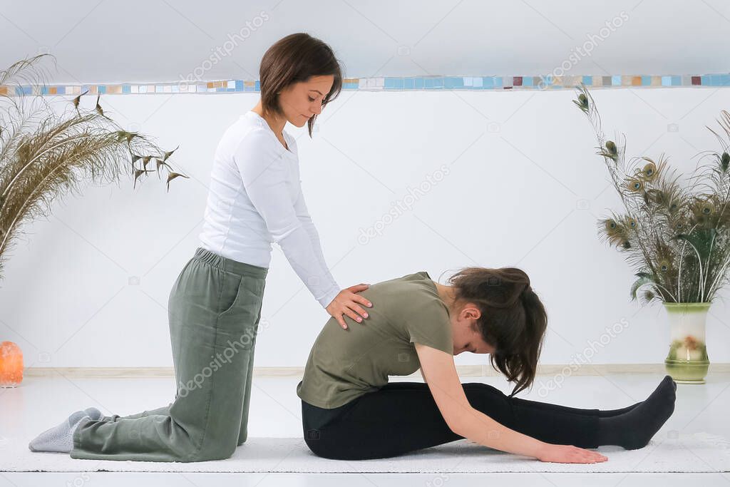 Teenager getting Shiatsu massage from Shiatsu masseuse