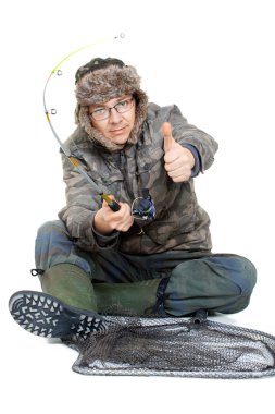 Fisherman with fishing rod in the studio clipart