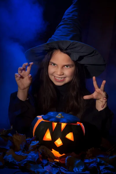 The little witch with halloween pumpkin — Stock Photo, Image