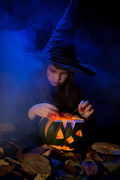 The little witch with halloween pumpkin — Stock Photo, Image