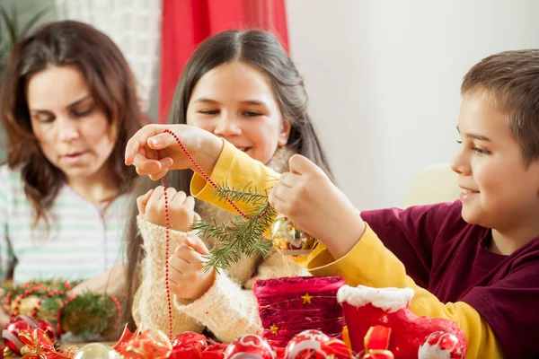 Happy young family getting ready for the Advent, Christmas holid — Stock Photo, Image