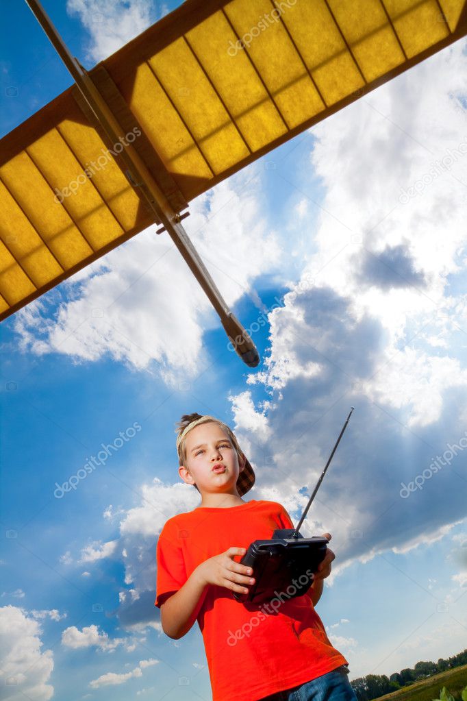 Little boy playing with airplane