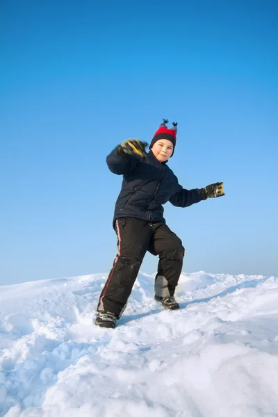 Little child playing in snow — Stock Photo, Image