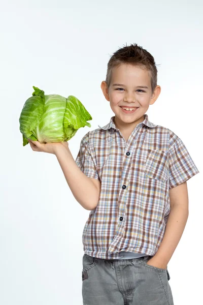 Красива дитина з овочами — стокове фото