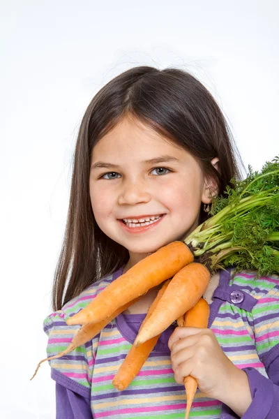 Mooie kleine childl met plantaardige — Stockfoto