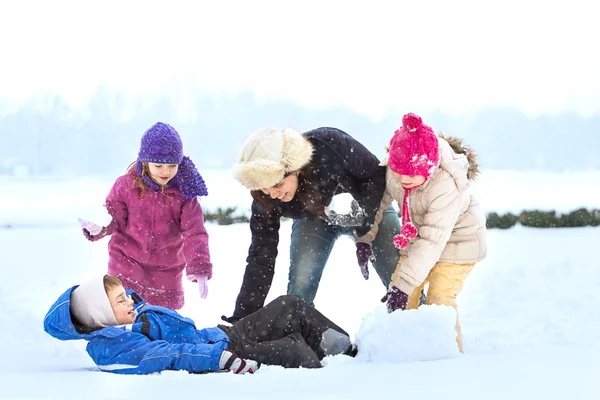 Happy family enjoying in winter — Stock Photo, Image