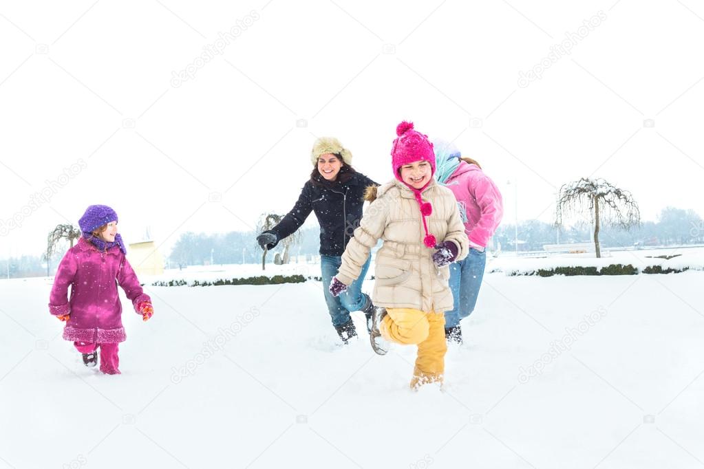 Happy family enjoying in winter