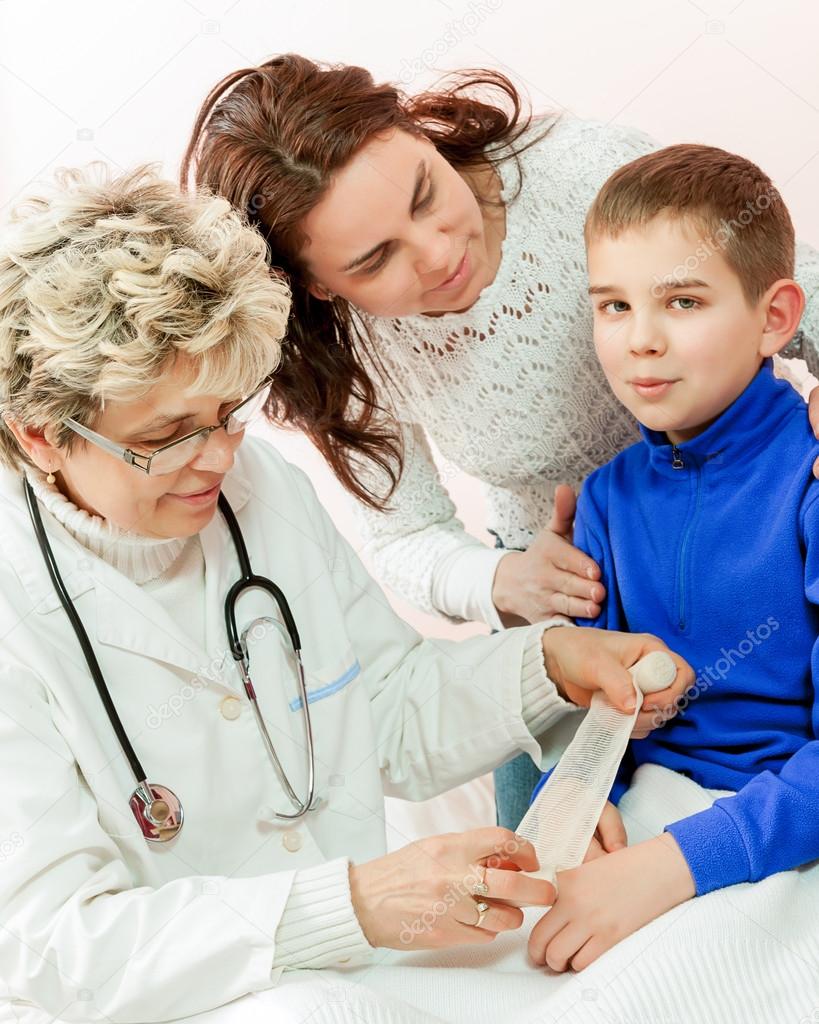 Doctor examining a child in a hospital