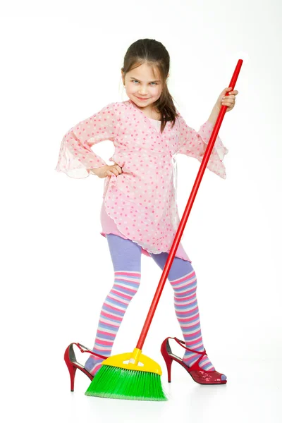 Cute little girl singing during cleaning — Stock Photo, Image