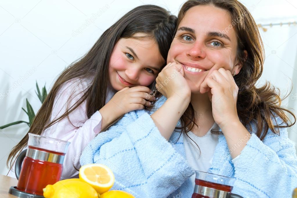 Mother and daughter with cold or flu