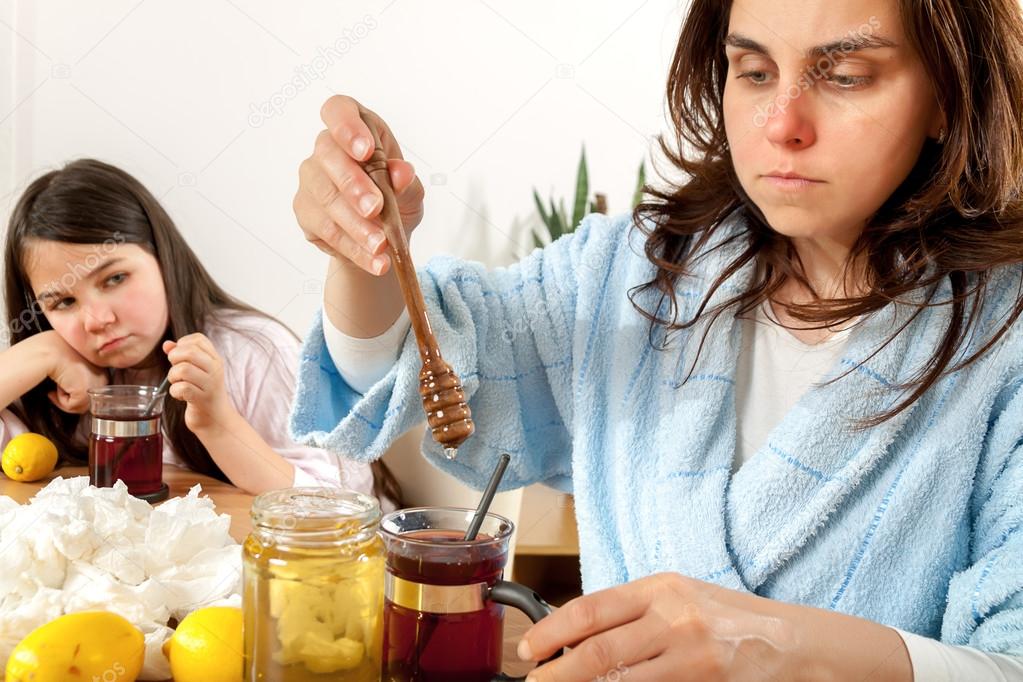 Mother and daughter with cold or flu