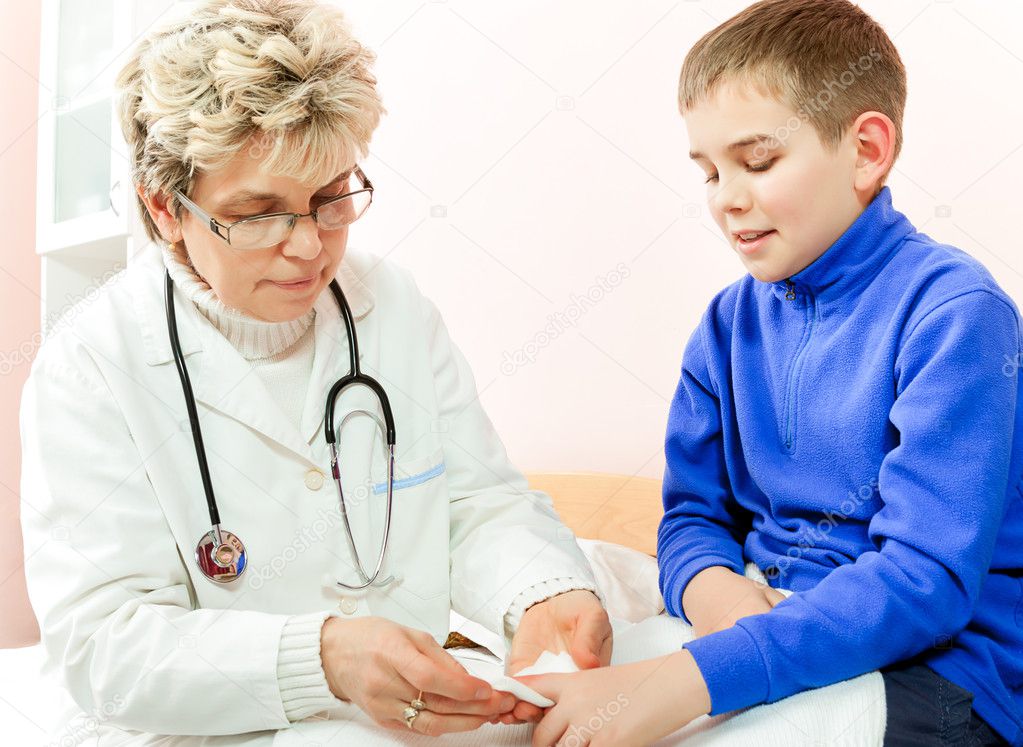 Doctor examining a child in a hospital