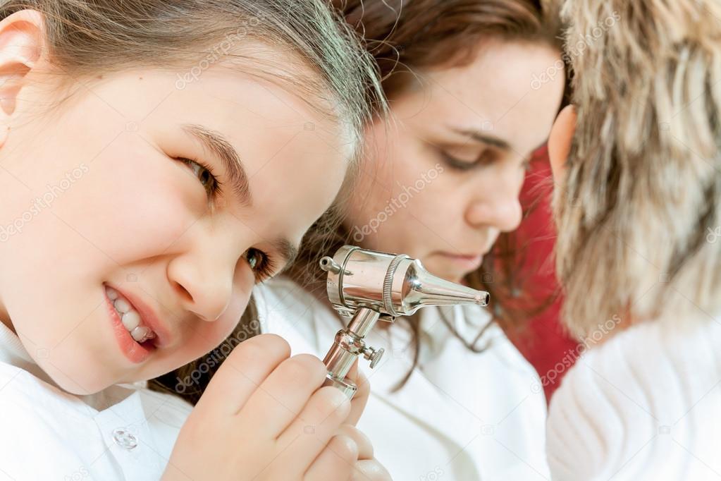 Doctor examining a child in a hospital