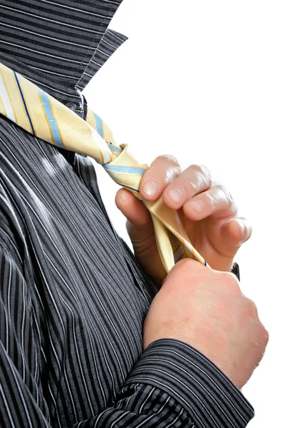 Well dressed business man adjusting his neck tie — Stock Photo, Image