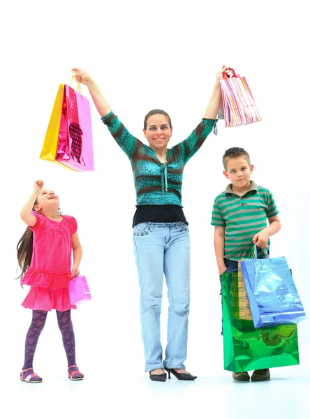 Happy cheering family in white room — Stock Photo, Image