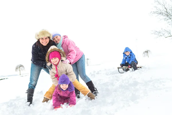 Happy family enjoying in winter Stock Photo