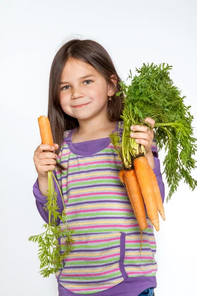 Mooie kleine childl met plantaardige — Stockfoto