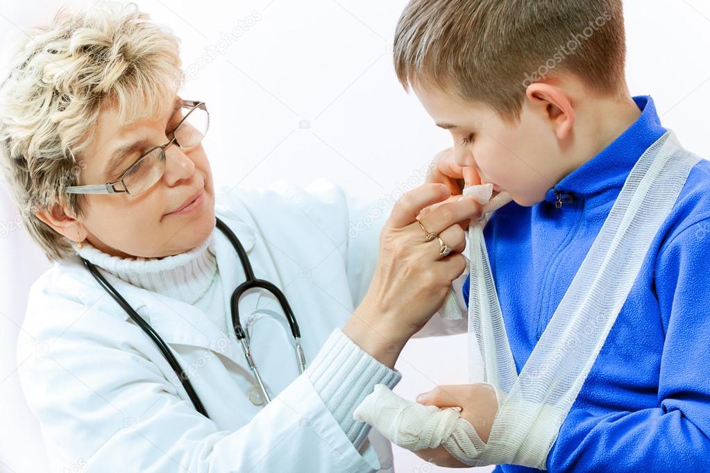 Doctor examining a child in a hospital