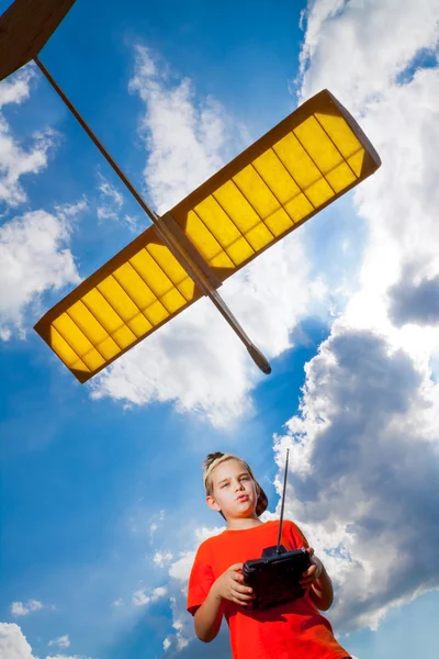 Little boy playing with airplane — Stock Photo, Image