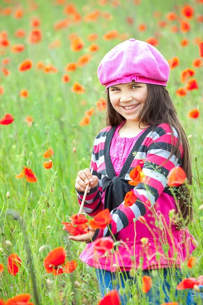 Vintage little girl on the poppy meadow — Stock Photo, Image