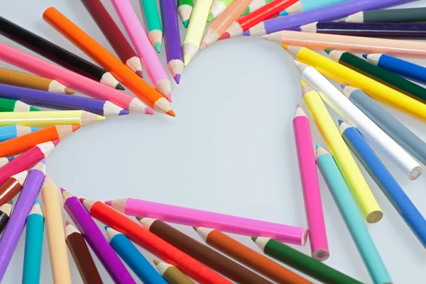 Colored pencils heart shape — Stock Photo, Image