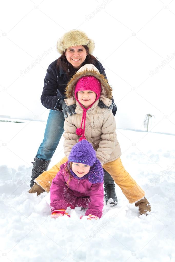 Happy family enjoying in winter