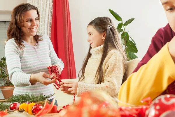 Happy young family getting ready for the Advent, Christmas holid — Stock Photo, Image