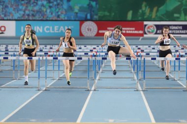 ISTANBUL, TURKEY - FEBRUARY 06, 2021: Athletes running 60 metres hurdles during Turkish Indoor Athletics Championships